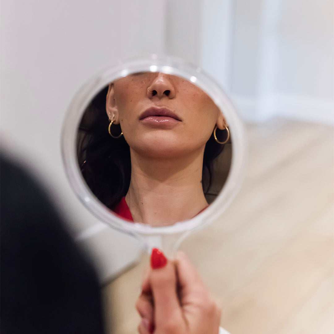 woman holding mirror