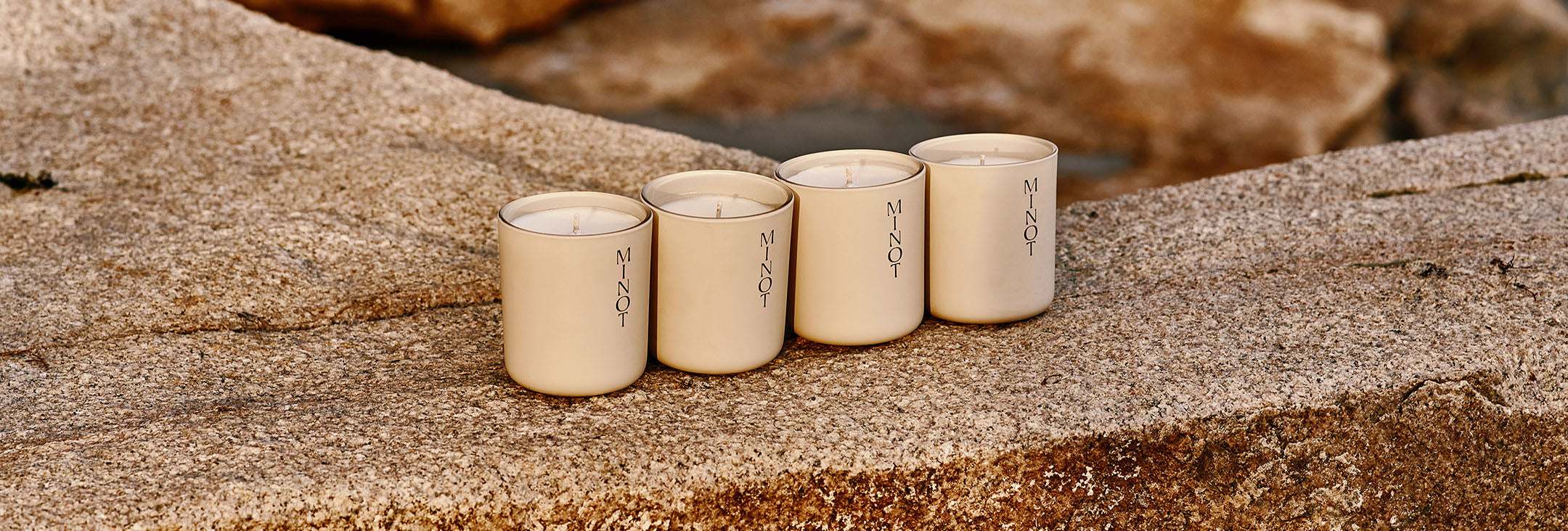 minot candle collection on a rock